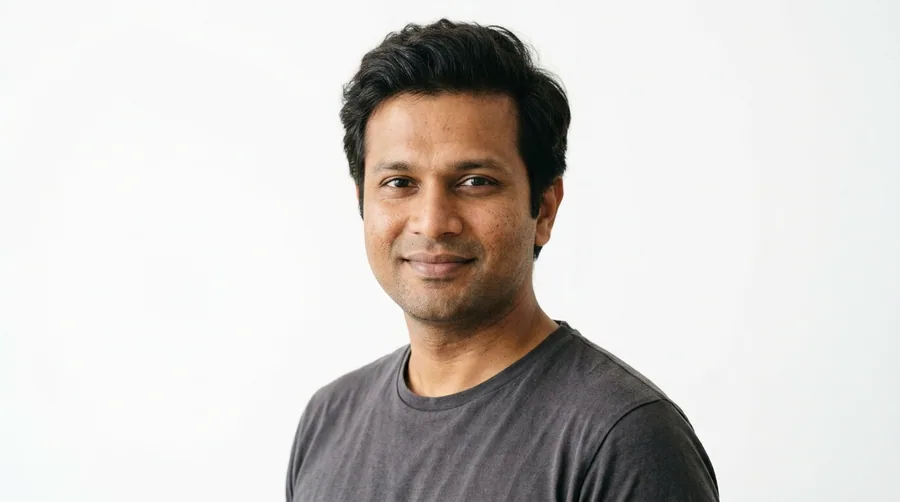 Portrait of a man in his thirties with full natural hair