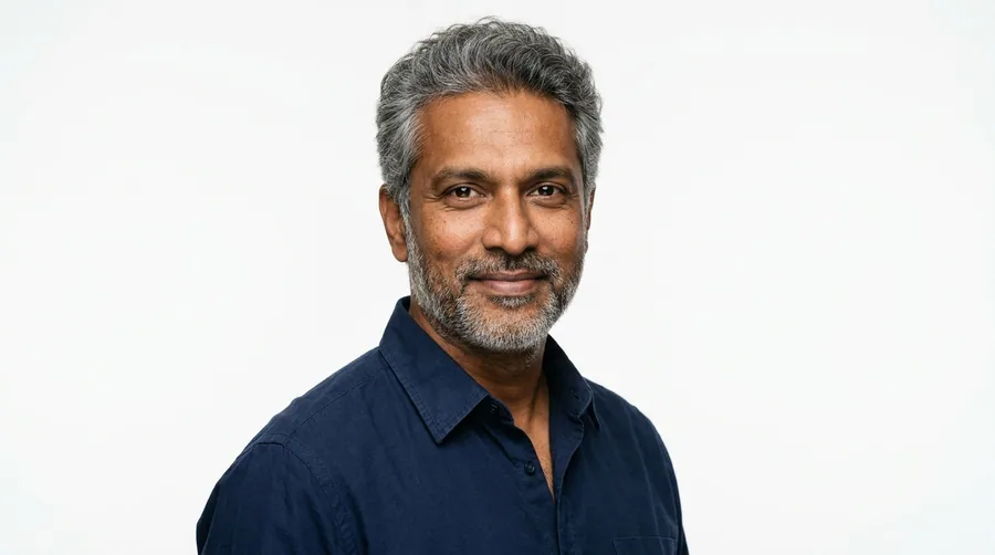 Portrait of a man in his late forties with full salt-and-pepper hair
