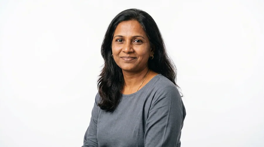 Portrait of a woman in her forties with a full natural side parting